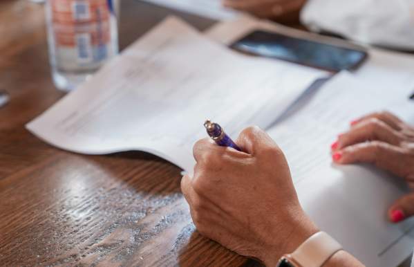 A woman filling out a loan application.